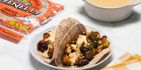 Roasted Poblano and Butternut Squash Tacos a plate of vegan tacos with peppers and squash