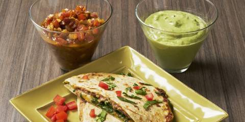 a healthy quesadilla with salsa and guacamole