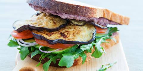 Grilled Eggplant and Tomato Sandwiches grilled eggplant on bread with crumbled cheese
