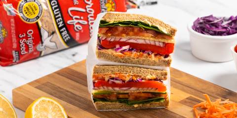 a very well-stacked veggie sandwich