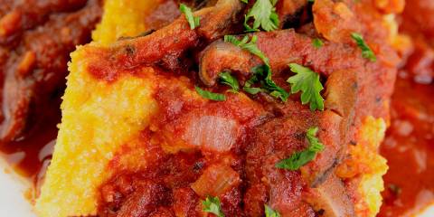 polenta slathered in spaghetti sauce and mushrooms