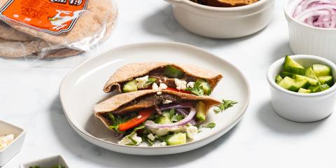Oven-Roasted Portabella Mushroom Gyro a pita pocket stuffed with portabella mushrooms and veggies