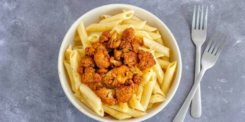 Penne with Spice-Roasted Cauliflower a bowl of penne with spicy roasted cauliflower on top