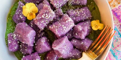 Purple Cauliflower Gnocchi a bowl of cauliflower gnocchi on greens