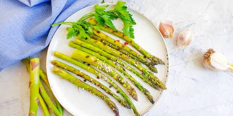 Roasted Asparagus with Garlic a plate of asparagus with garlic