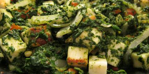 Saag Paneer a pan of spinach and cooking cheese