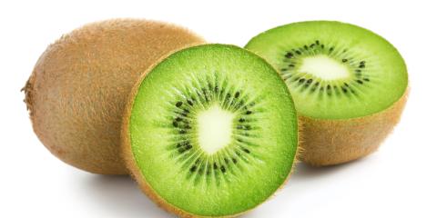One kiwi cut in half and another whole. 
