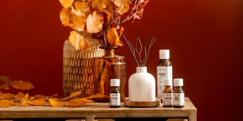 Fall Leaves Reed Diffuser wooden dresser with vase full of fall branches, essential oils and reed diffuser