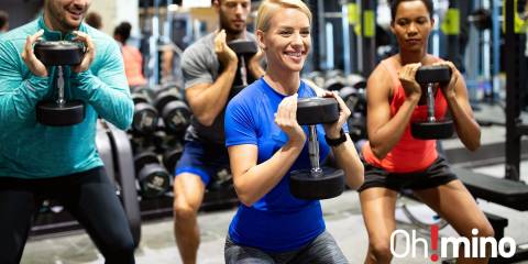 a group of happy people working out to build muscle