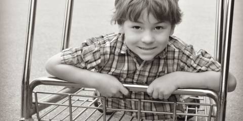 Black Friday shopping child in plaid shirt 
