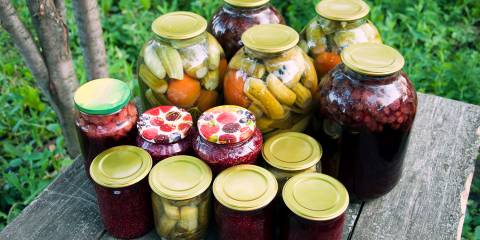 Canned foods on a rustic wooden table