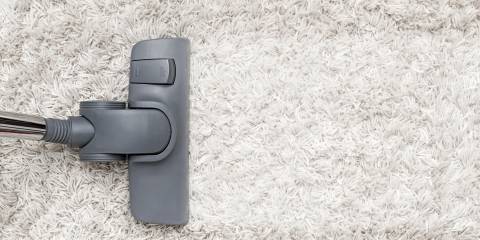 Vacuum on white shag carpet.