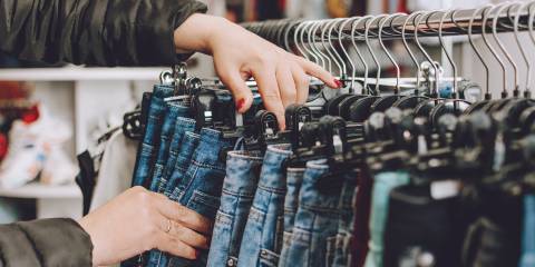 How Clothing Choices Affect the Environment a woman shopping for jeans