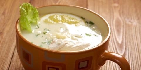 Avgolemono Soup A mug of avgolemono soup with garnish