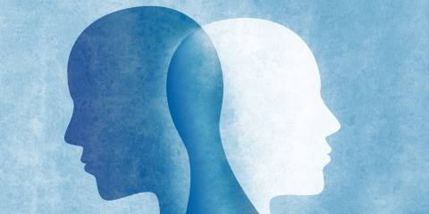 Bipolar Disorder overlapping silhouettes standing back-to-back