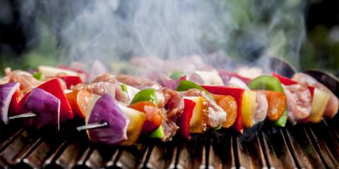 shish kebabs with vegetables, fruit, and meat, smoking and steaming