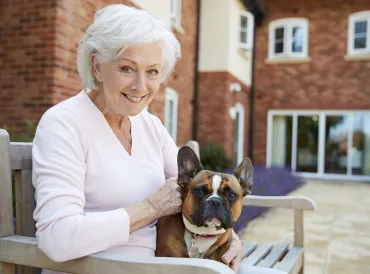 an older woman and a bulldog with sagging jowls