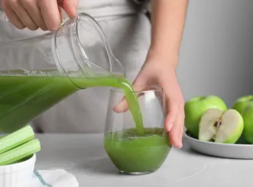 Celery juice being poured 