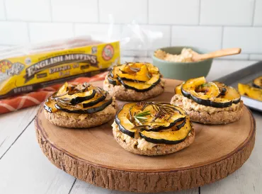 english muffins topped with squash and vegan cheese