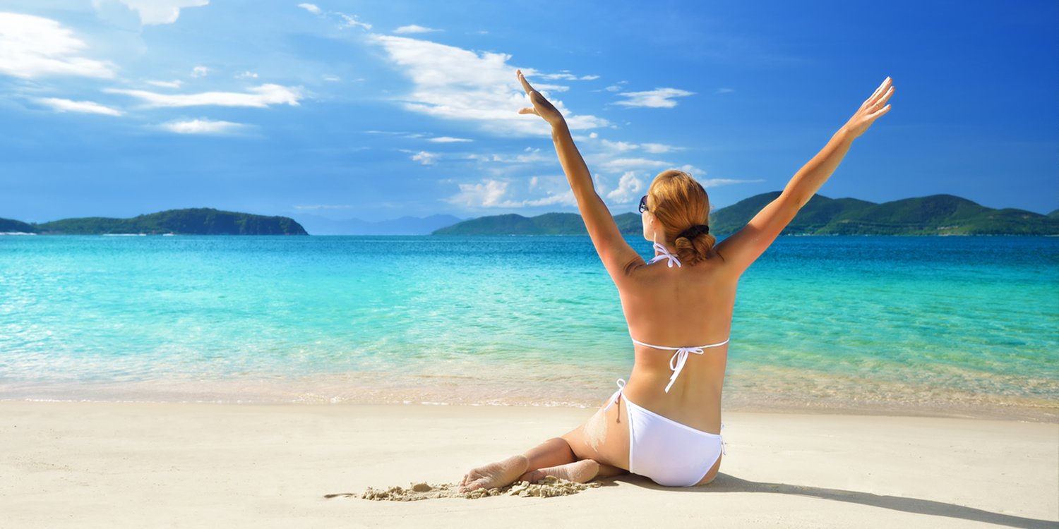 Woman in a good mood on the beach