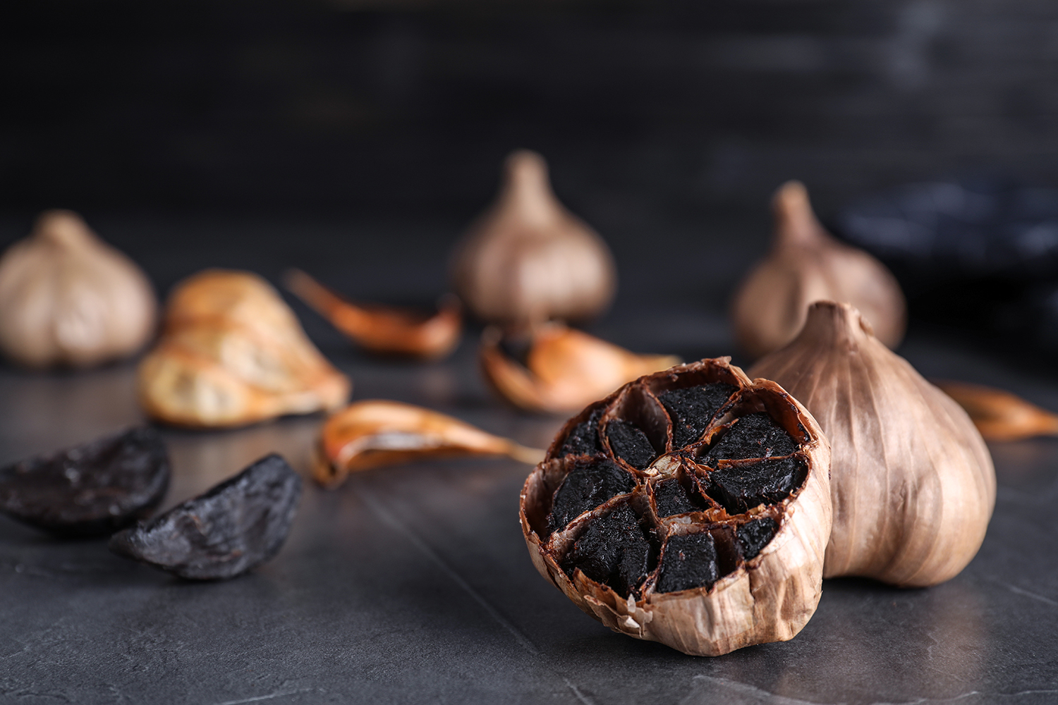 cloves of aged black garlic