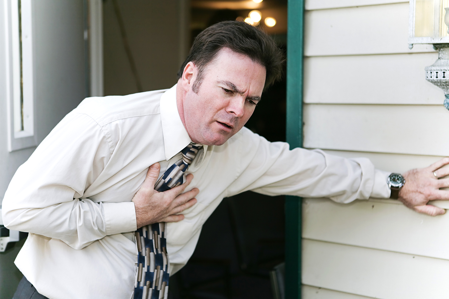 a man almost collapsing from chest pain