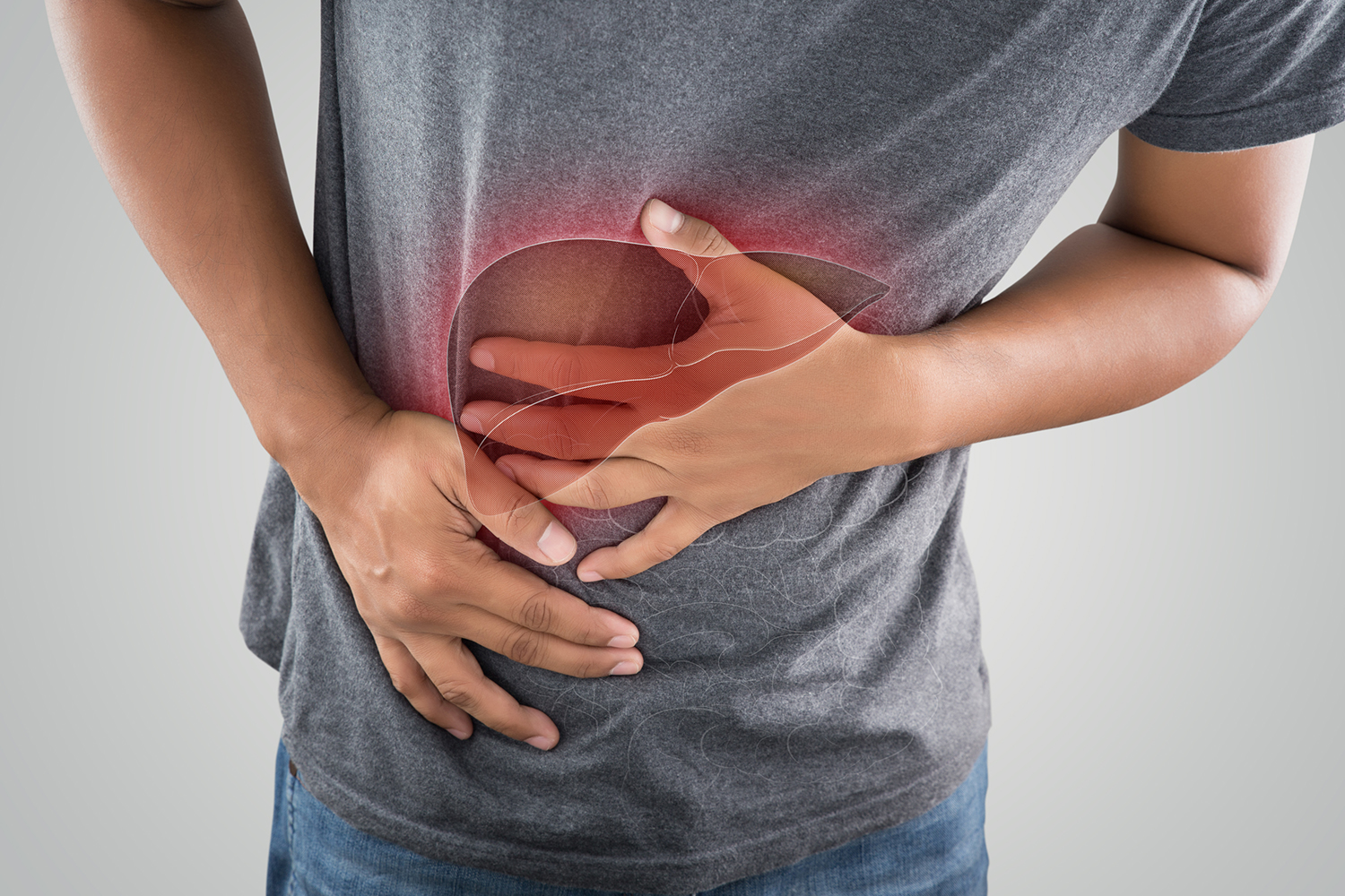 a man holding his liver in pain