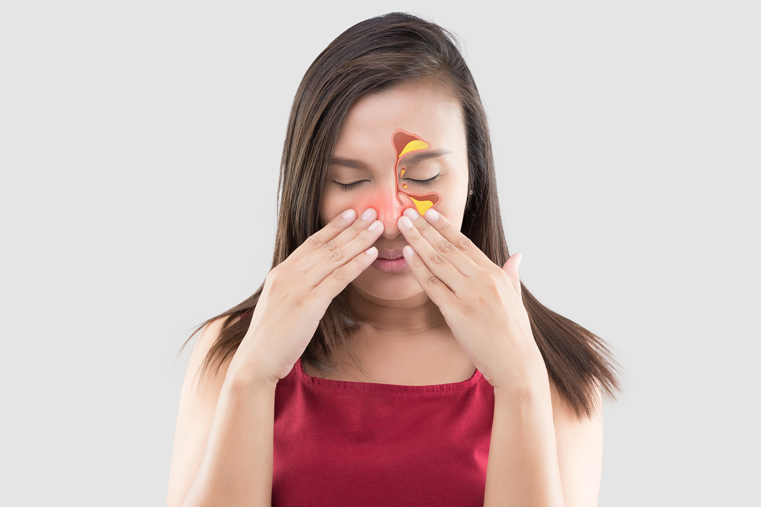a young woman massaging her sinuses