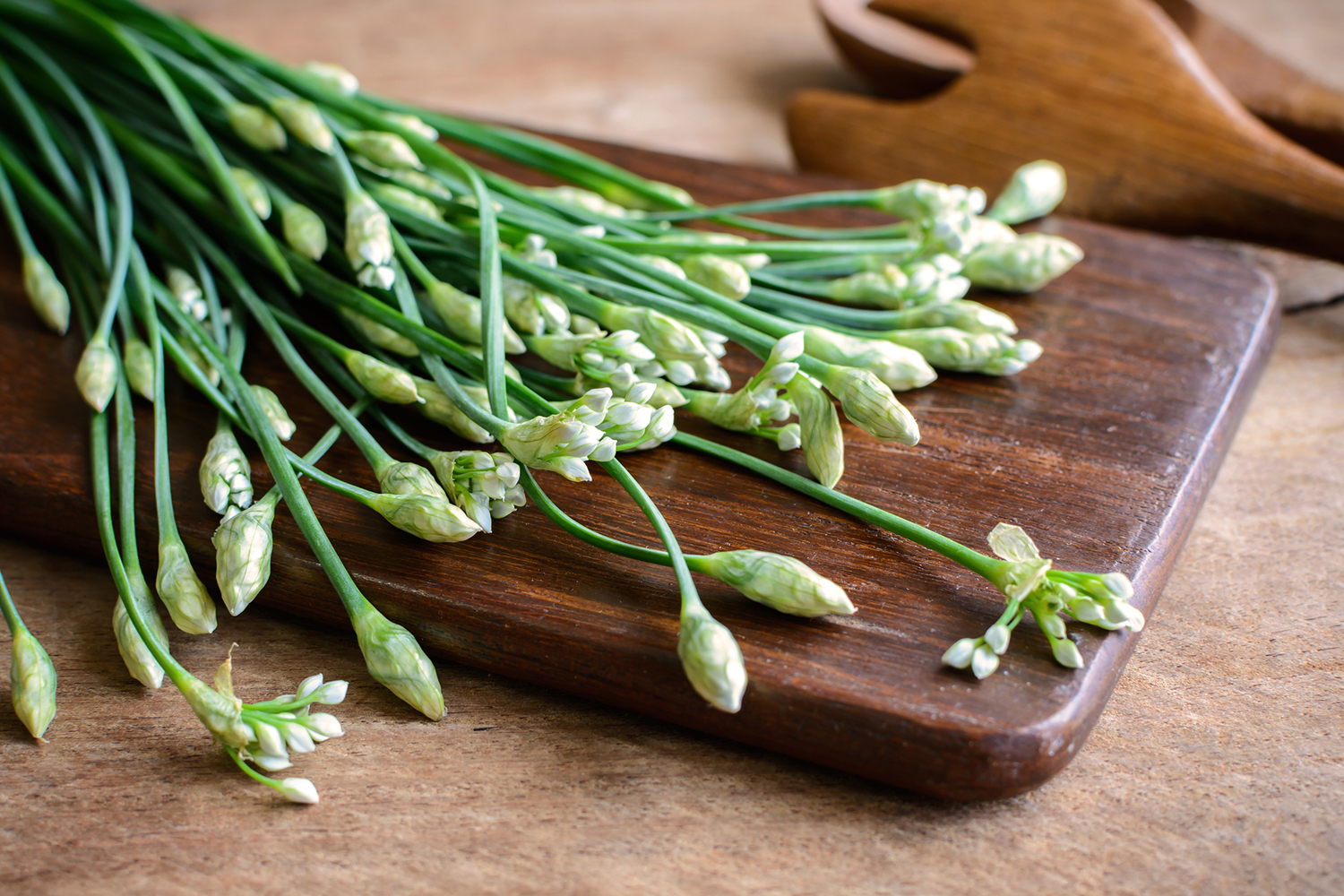 garlic chives on a cutting board